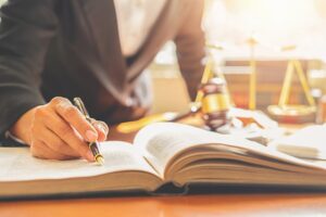 judge-gavel-with-justice-lawyers-having-team-meeting-law-firm-background_1418-2190